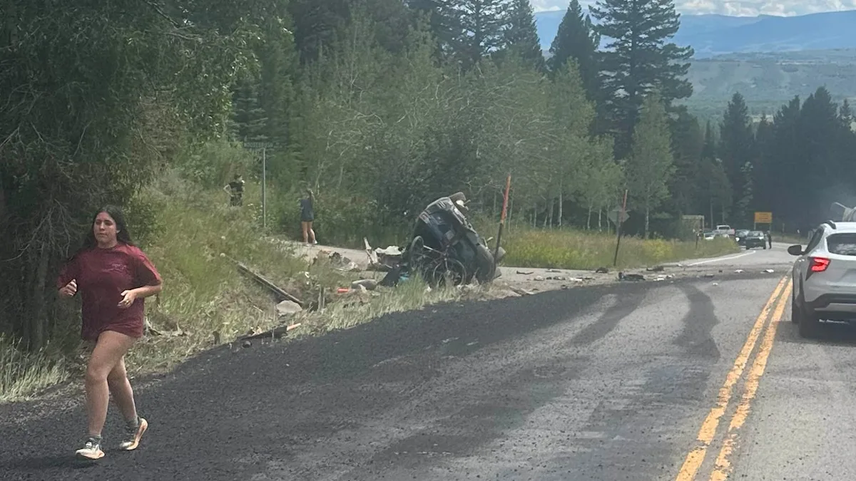 Emergency response vehicles at the scene of a fatal dump truck crash on a mountain pass